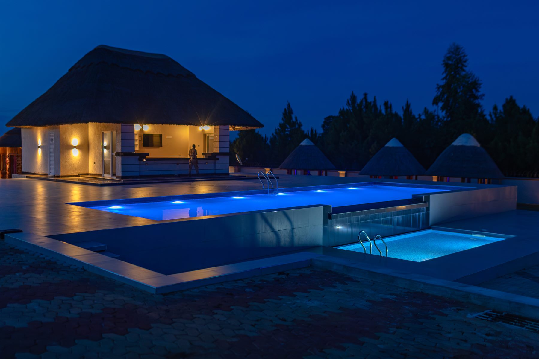 Night view of the swimming pool at ATM Comfort Zone